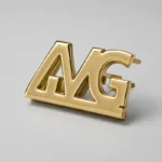 Logo métallique doré AMG pour sac